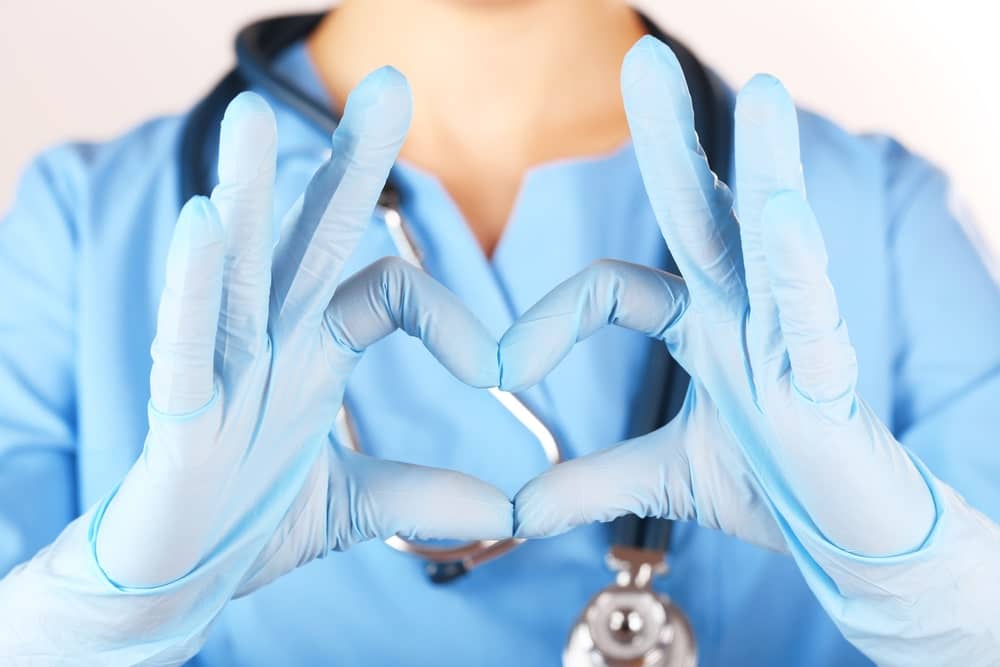 Nurse-Making-Heart-Shape-With-Her-Fingers