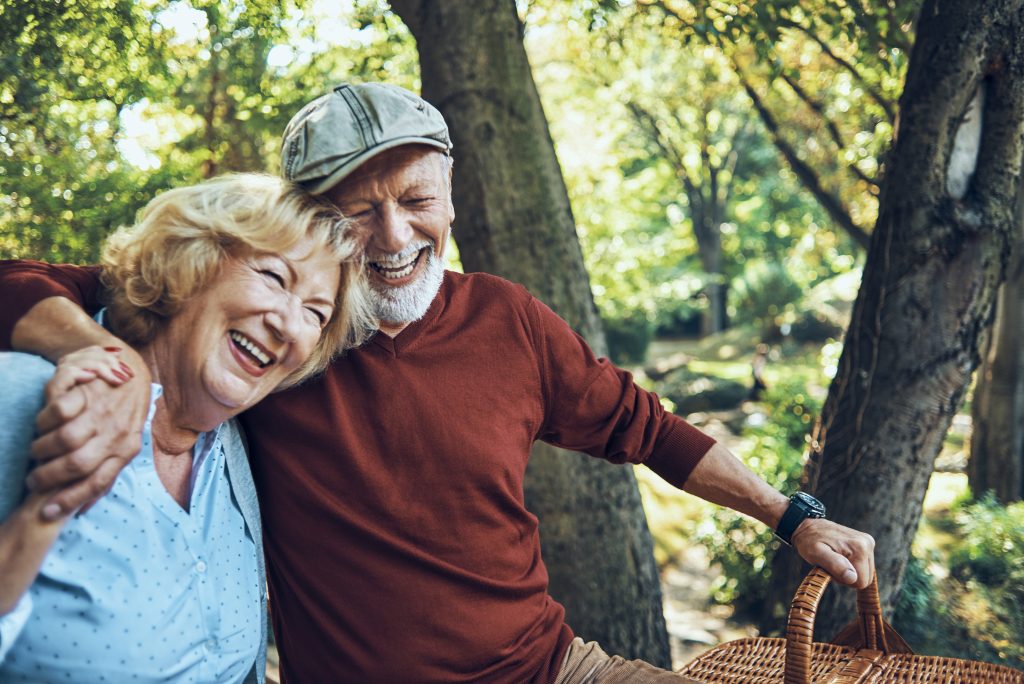 happy senior couple enjoying their day in nature